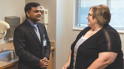 Dr. Mukund Kumar, a rheumatologist, meeting with a patient.