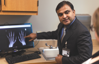 Dr. Mukund Kumar, a rheumatologist, in an appointment with a patient.