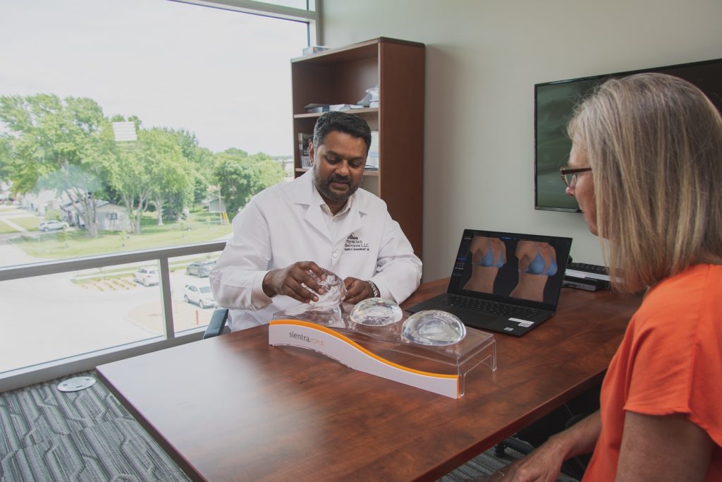 Dr. Mark Shashikant explaining options for breast enhancement.