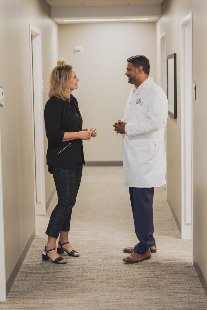 Dr. Mark Shashikant talking with a patient.