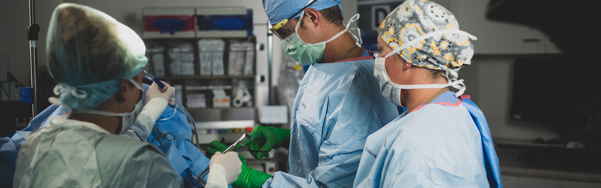 An orthopedic surgeon performing a joint replacement surgery.