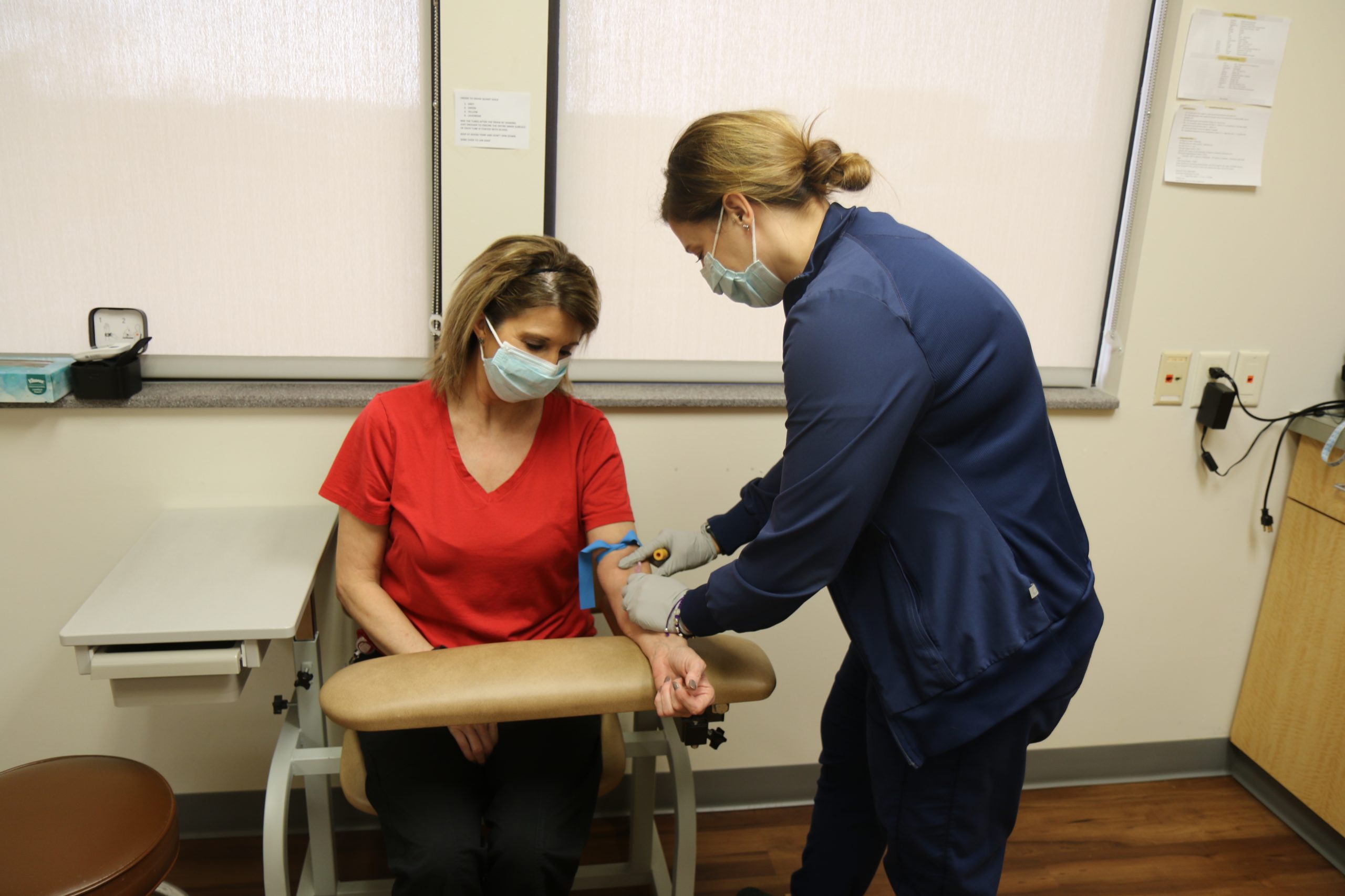 nurse drawing blood