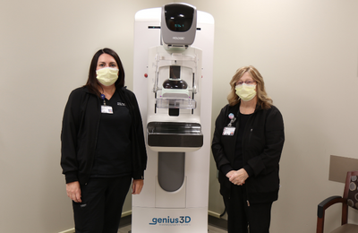 Our mammography techs with our 3D mammography machine.
