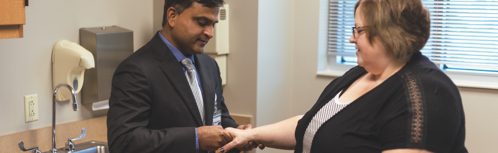 Dr. Kumar, a rheumatologist, meeting with a patient.