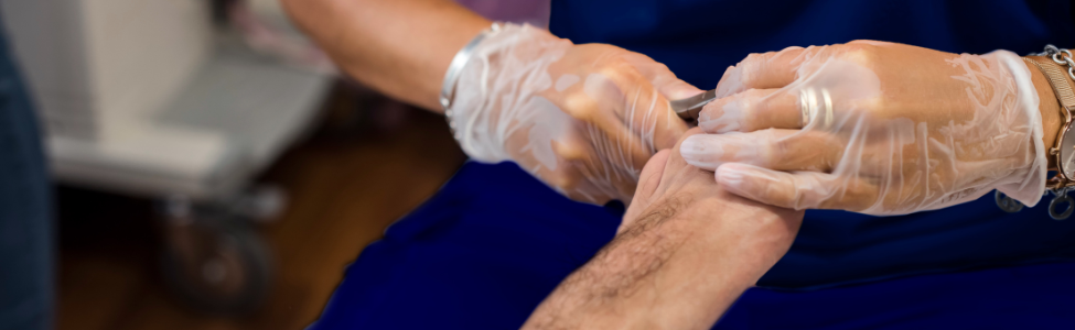 Certified foot care specialist performing nail care.